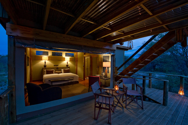 View into guest room with stairs leading to the sleep-out deck