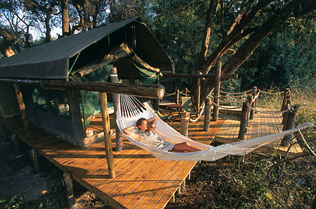 A guest relaxes in her hammock for an afternoon siesta