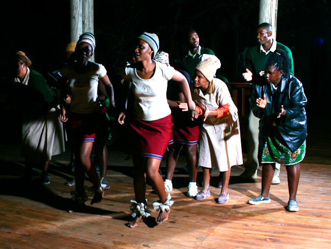 Camp staff performing a traditional dance