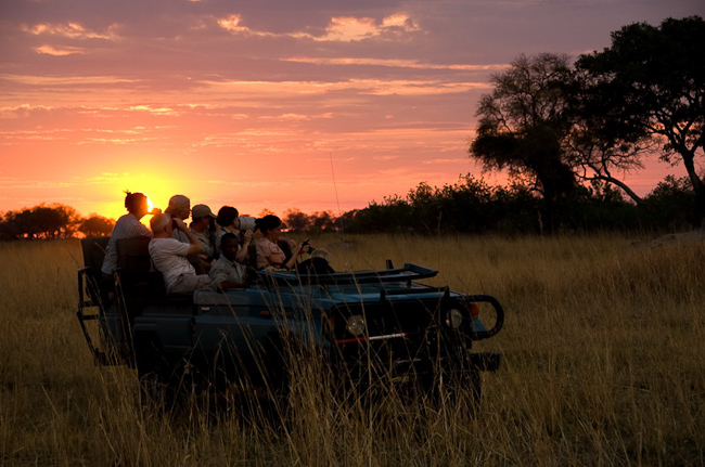 Game drive and setting sun