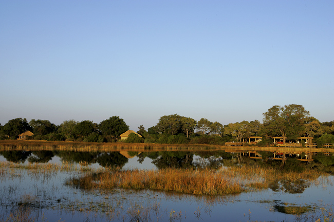 Vumbura Plains camp viewed from across Kaparota lagoon