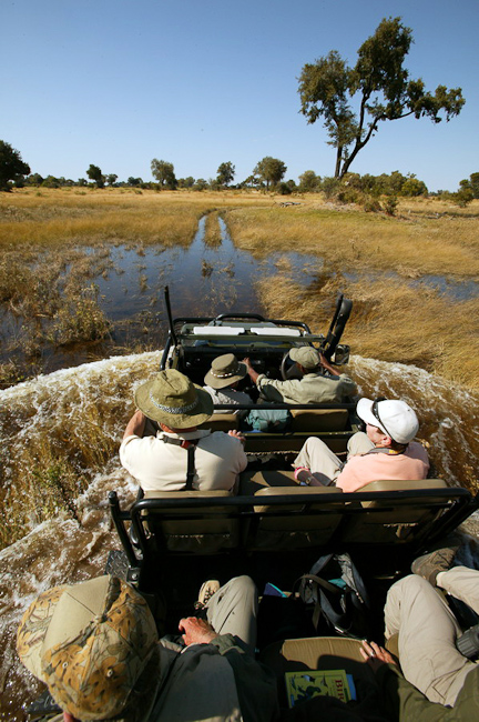 Driving in deep water at Vumbura Plains