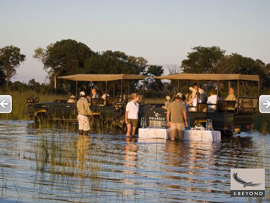 Sundowner drinks in the Okavango waters