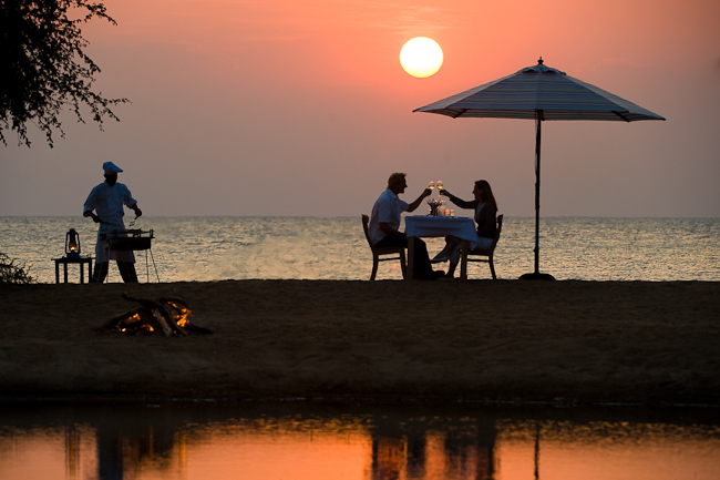 Enjoying a delicious meal on the beach cooked in front of you