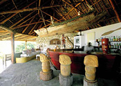 The bar with its heavy Mozambican hardwood stools