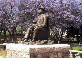 Statue of a Namibian hero under the jacarandas trees - Gardens of Tintenpalast, Windhoek, Nambia.