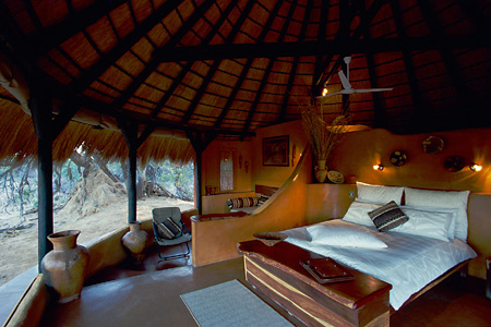 Guest chalet and bedroom, Okonjima Luxury Bush Camp