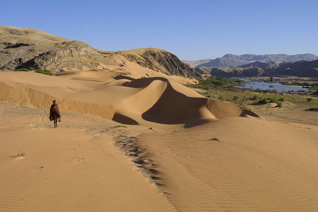 Himba walking the dunes near camp