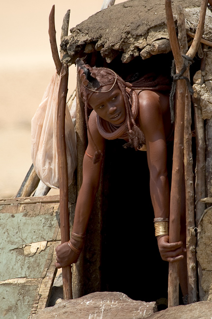 Himba woman in hut