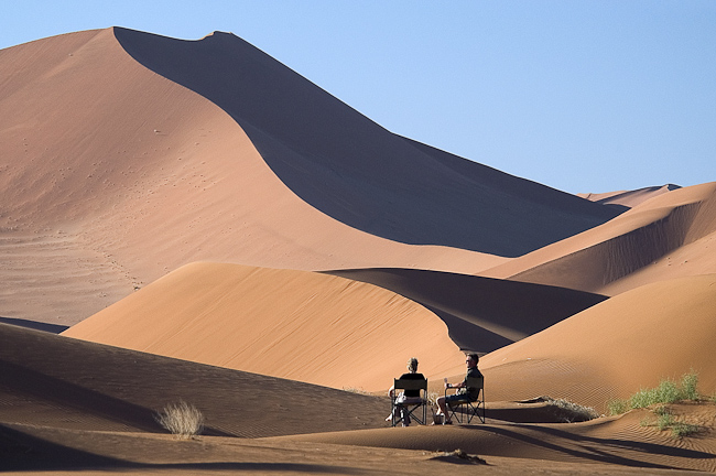 Having drinks on the red dunes at Sossusvlei, Namibia