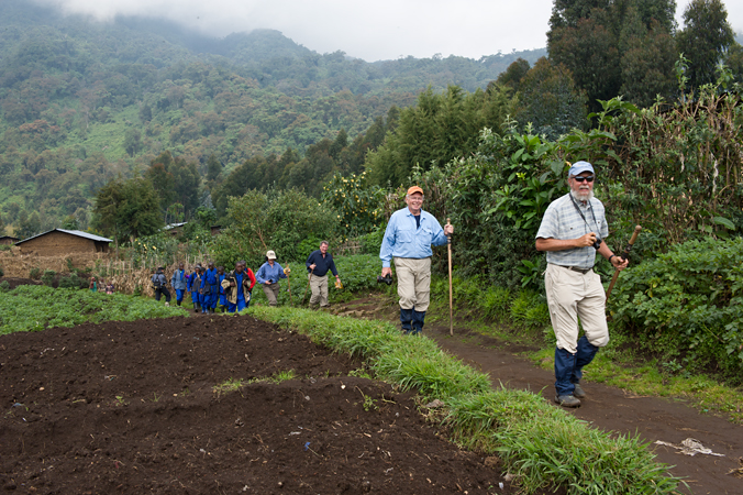Trekking through farm fields en route to Bisoke volcano and Amahoro Group, Rwanda