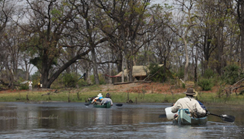 Canoes in front of Selinda Explorers Camp, Botswana.