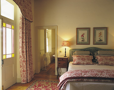 The Disa room, with its king-sized bed, has French doors opening onto the verandah