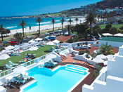 The Bay Hotel swimming pool overlooks Camps Bay Beach