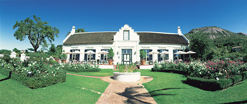 The historic Grande Roche manor house and Paarl Rock in Paarl, South Africa