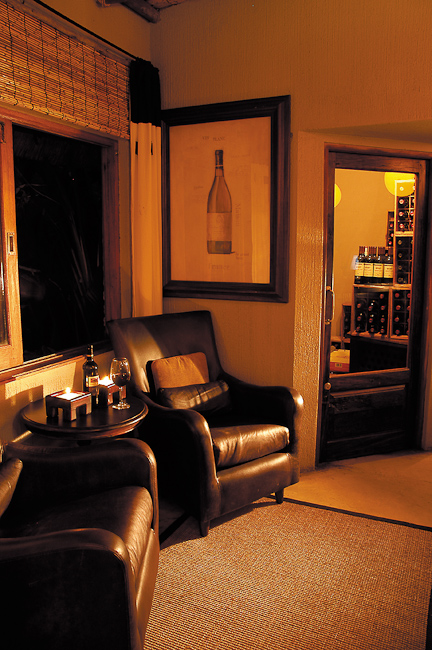 Lounge seating and view into wine cellar