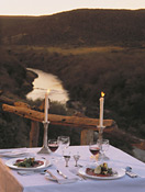 Great Fish River Lodge deck dining, with sunsets over the river below