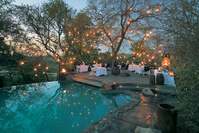 Twilight dinner at Singita Boulders Lodge pool