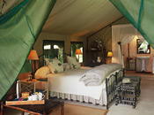 Guest bed and tent interior, Tanda Tula Safari Camp